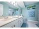 Double vanity bathroom with a neutral color scheme at 5901 Bahia Del Mar Cir # 321, St Petersburg, FL 33715