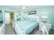King-size bed in a well-lit bedroom with en-suite bath access at 5901 Bahia Del Mar Cir # 321, St Petersburg, FL 33715