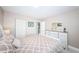 Bedroom with white dresser and a bed with patterned bedding at 5901 Bahia Del Mar Cir # 321, St Petersburg, FL 33715