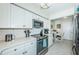 Modern white kitchen with stainless steel appliances at 5901 Bahia Del Mar Cir # 321, St Petersburg, FL 33715
