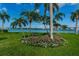 Landscaped garden with bench and flowers at 5901 Bahia Del Mar Cir # 321, St Petersburg, FL 33715