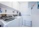 Laundry room with washer, dryer, and storage at 5901 Bahia Del Mar Cir # 321, St Petersburg, FL 33715