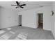 Bright bedroom with grey carpet and ensuite bathroom access at 5935 Parkset Dr, Lithia, FL 33547