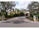 Grand two-story home with circular driveway and lush landscaping at 6324 W Maclaurin Dr, Tampa, FL 33647