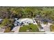 Aerial view of a house with a newly landscaped yard at 638 Mehlenbacher Rd, Belleair, FL 33756