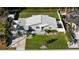 Aerial view of a house with a newly landscaped yard at 638 Mehlenbacher Rd, Belleair, FL 33756