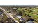 Aerial view of a house near a golf course and bay at 638 Mehlenbacher Rd, Belleair, FL 33756