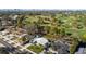 Aerial view of a house near a golf course and bay at 638 Mehlenbacher Rd, Belleair, FL 33756
