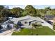 Aerial view showcases the home's location and landscape, backing to a golf course at 638 Mehlenbacher Rd, Belleair, FL 33756