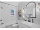 Stylish bathroom with white subway tile and modern fixtures at 638 Mehlenbacher Rd, Belleair, FL 33756