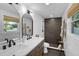 Modern bathroom with double vanity and walk-in shower at 638 Mehlenbacher Rd, Belleair, FL 33756