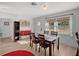 Bright dining area with wood table and chairs near the kitchen at 638 Mehlenbacher Rd, Belleair, FL 33756