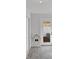 Laundry room with stackable washer and dryer and herringbone floor at 638 Mehlenbacher Rd, Belleair, FL 33756
