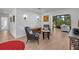 Bright living room features hardwood floors, comfy seating, and a view into the sunroom at 638 Mehlenbacher Rd, Belleair, FL 33756