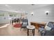 Open living area features light wood floors and comfortable seating near the kitchen at 638 Mehlenbacher Rd, Belleair, FL 33756