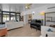 Spacious sunroom with plenty of natural light and comfortable seating at 638 Mehlenbacher Rd, Belleair, FL 33756