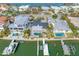 Aerial view of a waterfront property with multiple homes and docks at 65 Dolphin Dr, Treasure Island, FL 33706