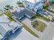 An aerial view of a waterfront home and its surroundings at 65 Dolphin Dr, Treasure Island, FL 33706