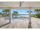 Covered patio overlooking the pool and waterfront at 65 Dolphin Dr, Treasure Island, FL 33706