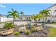 A waterfront home with palm trees and a paved driveway at 65 Dolphin Dr, Treasure Island, FL 33706
