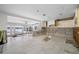 Renovation in progress: Kitchen with new tile floor and white cabinets at 65 Dolphin Dr, Treasure Island, FL 33706