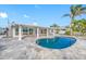 Relaxing kidney-shaped pool and spacious patio at 65 Dolphin Dr, Treasure Island, FL 33706