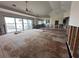 Large living room under renovation with water views at 7015 Bay St, St Pete Beach, FL 33706