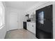 Modern kitchen with white cabinets and black appliances at 8718 N 15Th St, Tampa, FL 33604