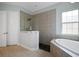 Bathroom with a large walk-in shower and soaking tub at 11910 Climbing Fern Ave, Riverview, FL 33579
