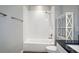 Clean bathroom with shower, tub, and white tile at 11910 Climbing Fern Ave, Riverview, FL 33579
