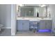 Spa-like bathroom with double vanity and large mirror at 11910 Climbing Fern Ave, Riverview, FL 33579