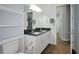 Bathroom with a double vanity and dark blue countertop at 11910 Climbing Fern Ave, Riverview, FL 33579