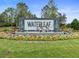 Waterleaf community entrance sign with landscaping at 11910 Climbing Fern Ave, Riverview, FL 33579