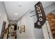 Hallway with framed pictures and a lounge sign at 11910 Climbing Fern Ave, Riverview, FL 33579