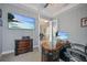 Bright home office with built-in desk and view to dining area at 11910 Climbing Fern Ave, Riverview, FL 33579