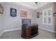 Home office features a large desk and neutral color scheme at 11910 Climbing Fern Ave, Riverview, FL 33579