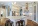 Open concept kitchen with large island, stainless steel appliances, and breakfast bar at 11910 Climbing Fern Ave, Riverview, FL 33579