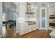 Modern kitchen with white cabinets, stainless steel appliances, and gas range at 11910 Climbing Fern Ave, Riverview, FL 33579