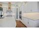 Modern kitchen with white cabinets, quartz countertops, and stainless steel appliances at 11910 Climbing Fern Ave, Riverview, FL 33579