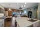 Modern kitchen with island and breakfast bar, open to Gathering room at 11910 Climbing Fern Ave, Riverview, FL 33579