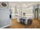 Spacious kitchen featuring white cabinets, stainless steel appliances, and an island at 11910 Climbing Fern Ave, Riverview, FL 33579