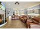 Spacious living room with fireplace and access to backyard at 11910 Climbing Fern Ave, Riverview, FL 33579