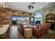 Open living area with fireplace and view to pool and patio at 11910 Climbing Fern Ave, Riverview, FL 33579