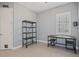 Bright office featuring industrial-style furniture and wood shelving at 11910 Climbing Fern Ave, Riverview, FL 33579