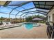Pool and spa with covered patio and lake view at 11910 Climbing Fern Ave, Riverview, FL 33579