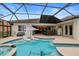 Large pool and spa with covered patio at 11910 Climbing Fern Ave, Riverview, FL 33579