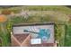 Unique guitar-shaped pool with a spa and screened enclosure at 11910 Climbing Fern Ave, Riverview, FL 33579