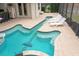 Enjoy this unique guitar shaped pool and spa at 11910 Climbing Fern Ave, Riverview, FL 33579