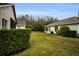 Landscaped backyard with grassy area at 1215 Dustan Pl, Trinity, FL 34655