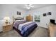 Cozy bedroom with double bed, nightstand and ceiling fan at 1215 Dustan Pl, Trinity, FL 34655